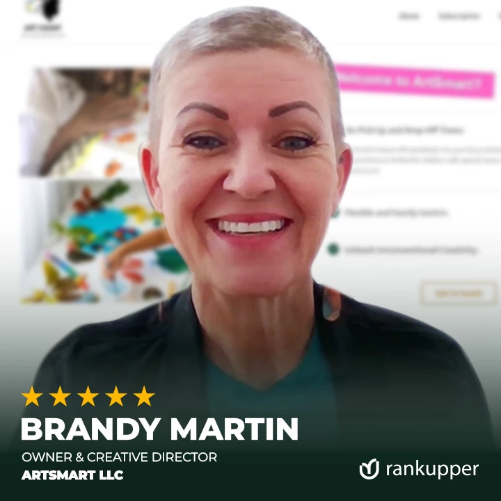 A smiling woman with curly hair, featured on the Rankupper career page, representing team positivity and growth.