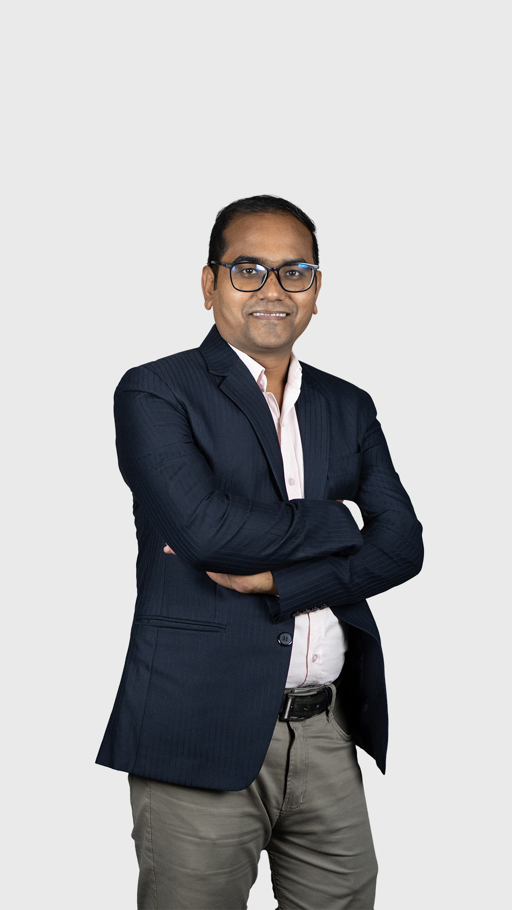 A man in glasses and a suit stands with arms crossed, representing Assistant Manager Biplab Debnath Rankupper.